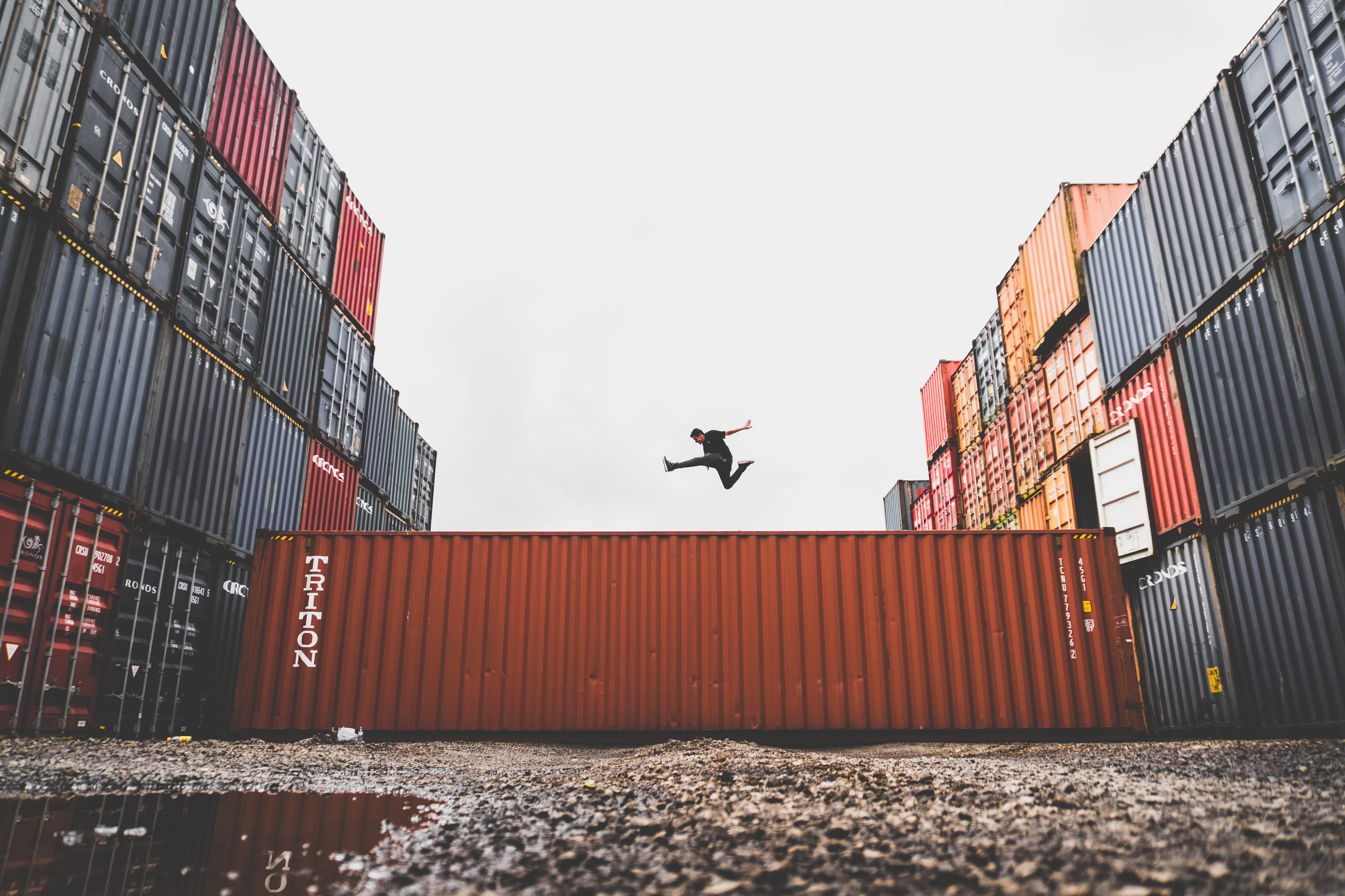 man-jumping-on-intermodal-container.jpg